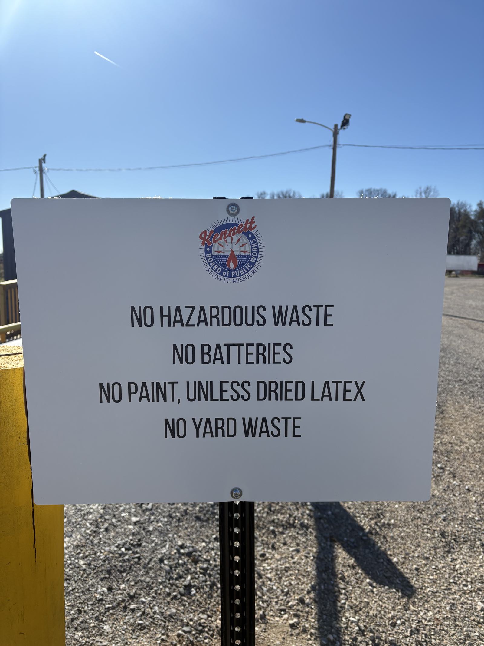 Posted transfer station rules sign: no hazardous waste, no batteries, no paint unless dried, no yard waste